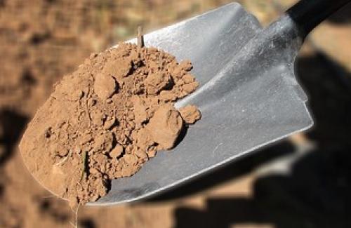 Shovel with dirt on it